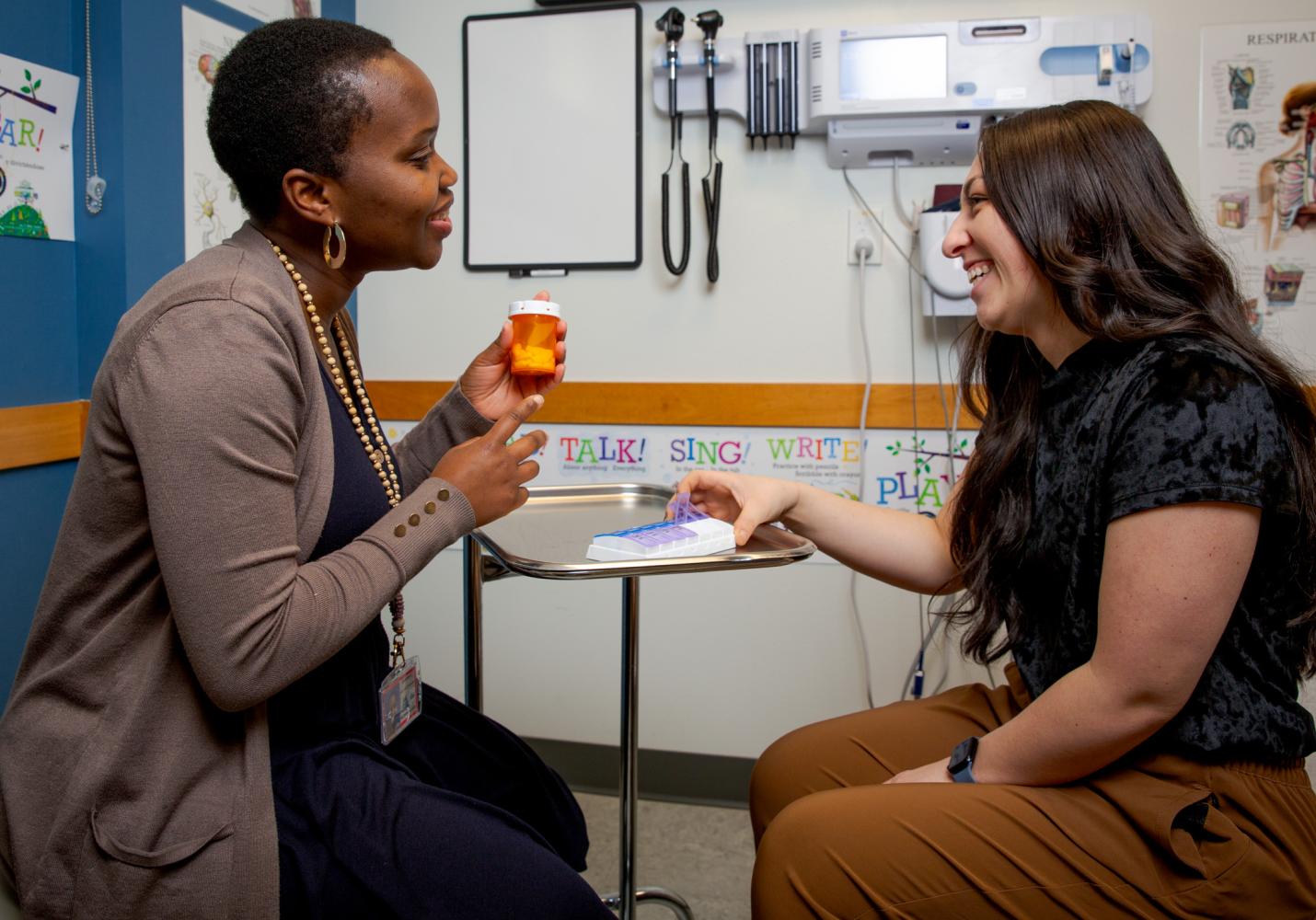 A pharmacist explains medication instructions to a patient.